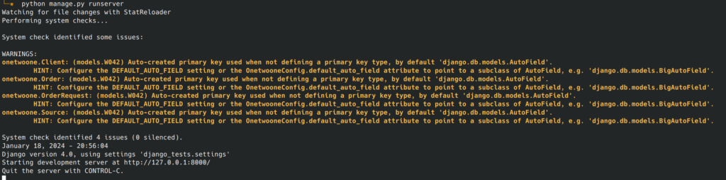 Screenshot of a Django app being launched and system checks warnings showing in the terminal.